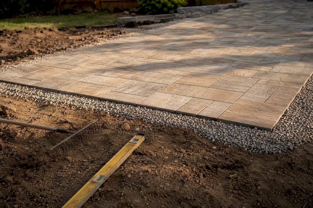 Pavers being compacted on clay soil base