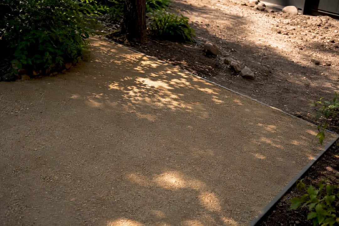 Shaded courtyard decomposed granite path wear