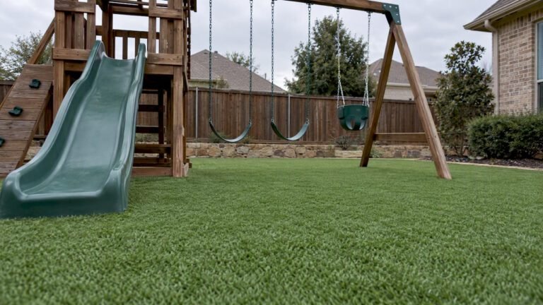 Playground turf surrounding backyard play equipment